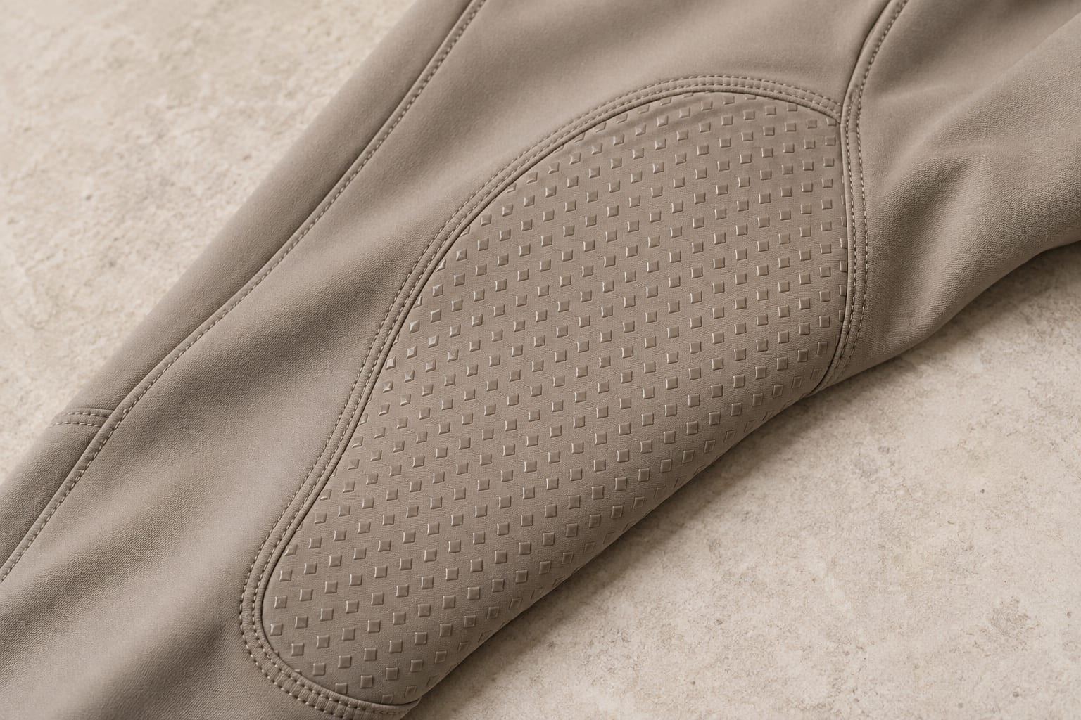 Riding breeches detail showing a material application concept